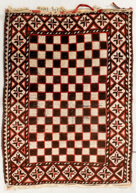 A semaintique/antique beludj carpet ca 115x86 cm.