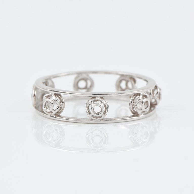 RING, Bliss, Italien. genombruten 18K vitguld med diamant på logoplatta 0.007ct.