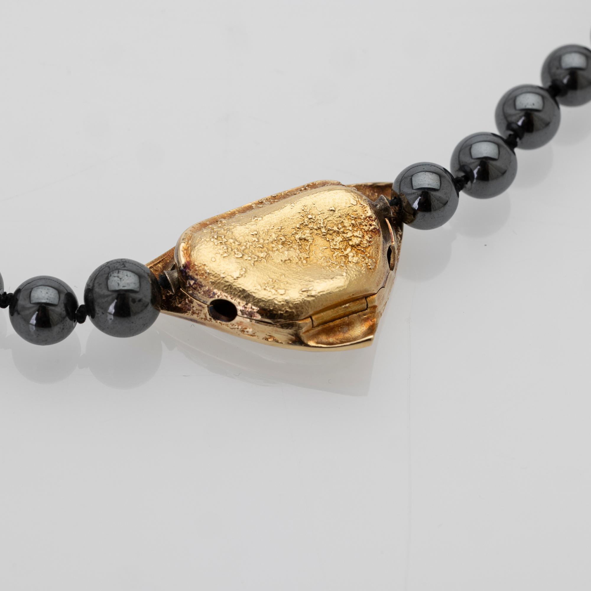 Ole Lynggaard, Hematite necklace with an 18K gold clasp and a diamond.