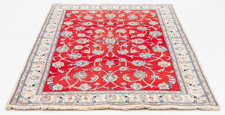 A carpet, Nain, approx. 256 x 158 cm.