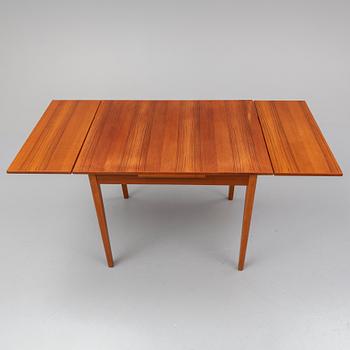 A 1950/60s teak veneered table.