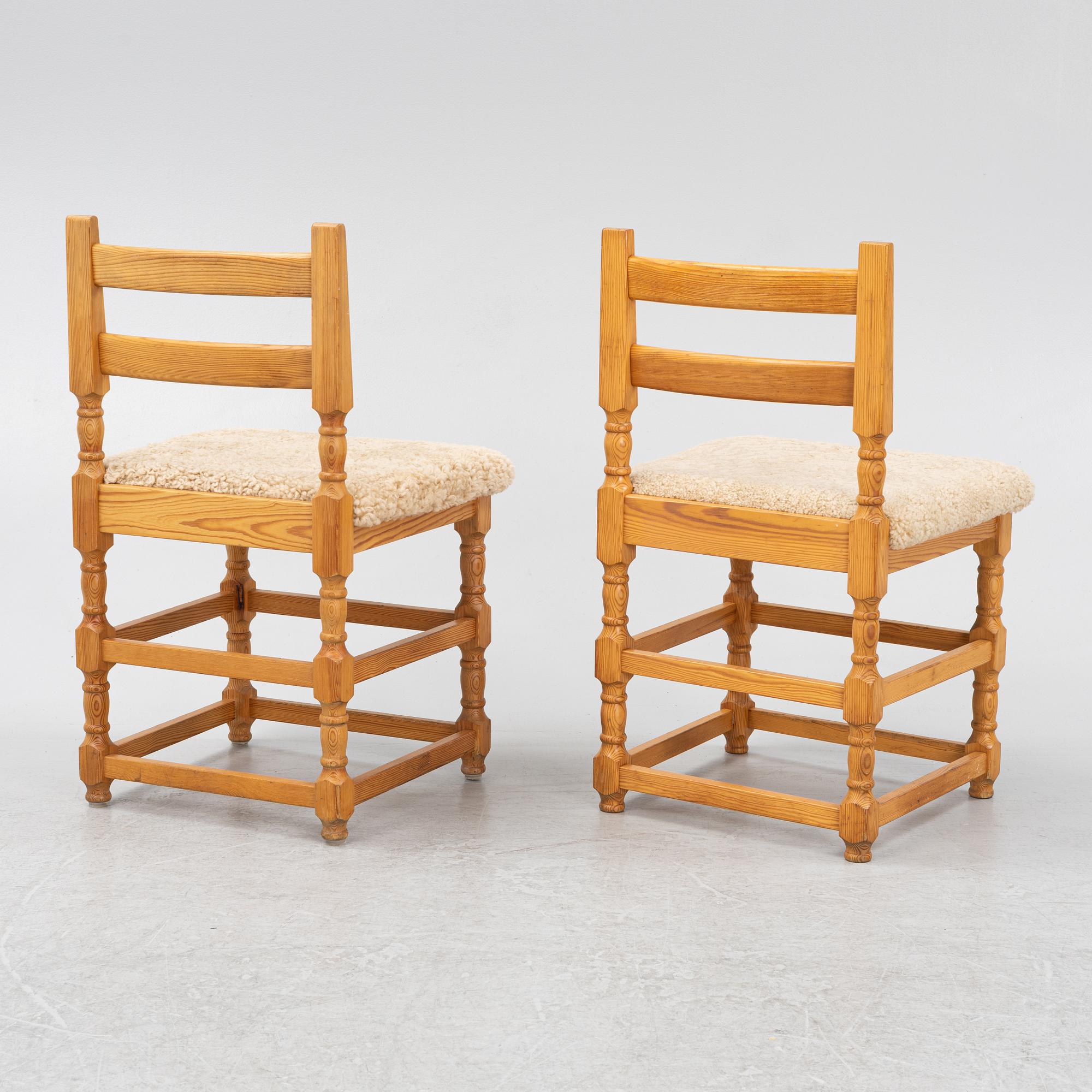 A set of eight pine chairs with new sheepskin upholstery, 1970s.