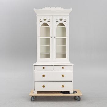 A display cabinet, late 19th century.