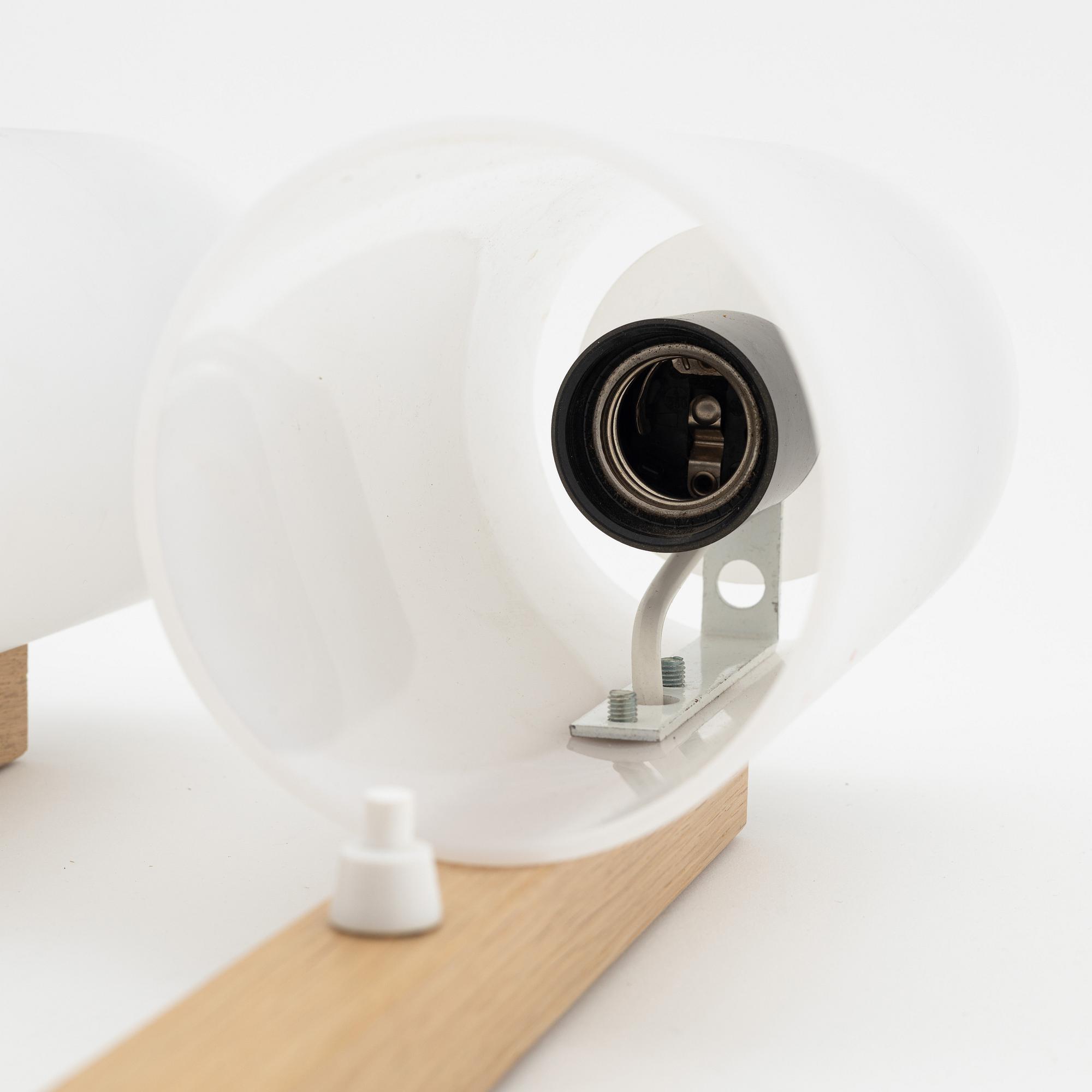 A pair of oak and acrylic wall lights, Luxus, Vittsjö.