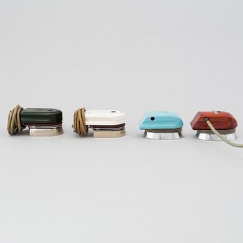 A set of four travel irons, mid 20th century.