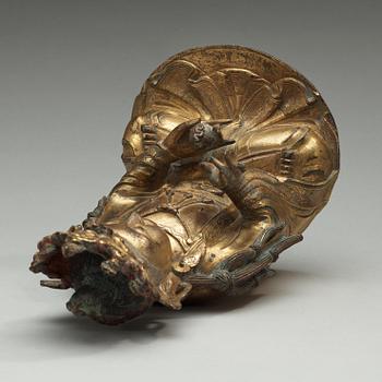 A  gilt-bronze figure of a seated Guanyin, Ming dynasty (1368-1644).