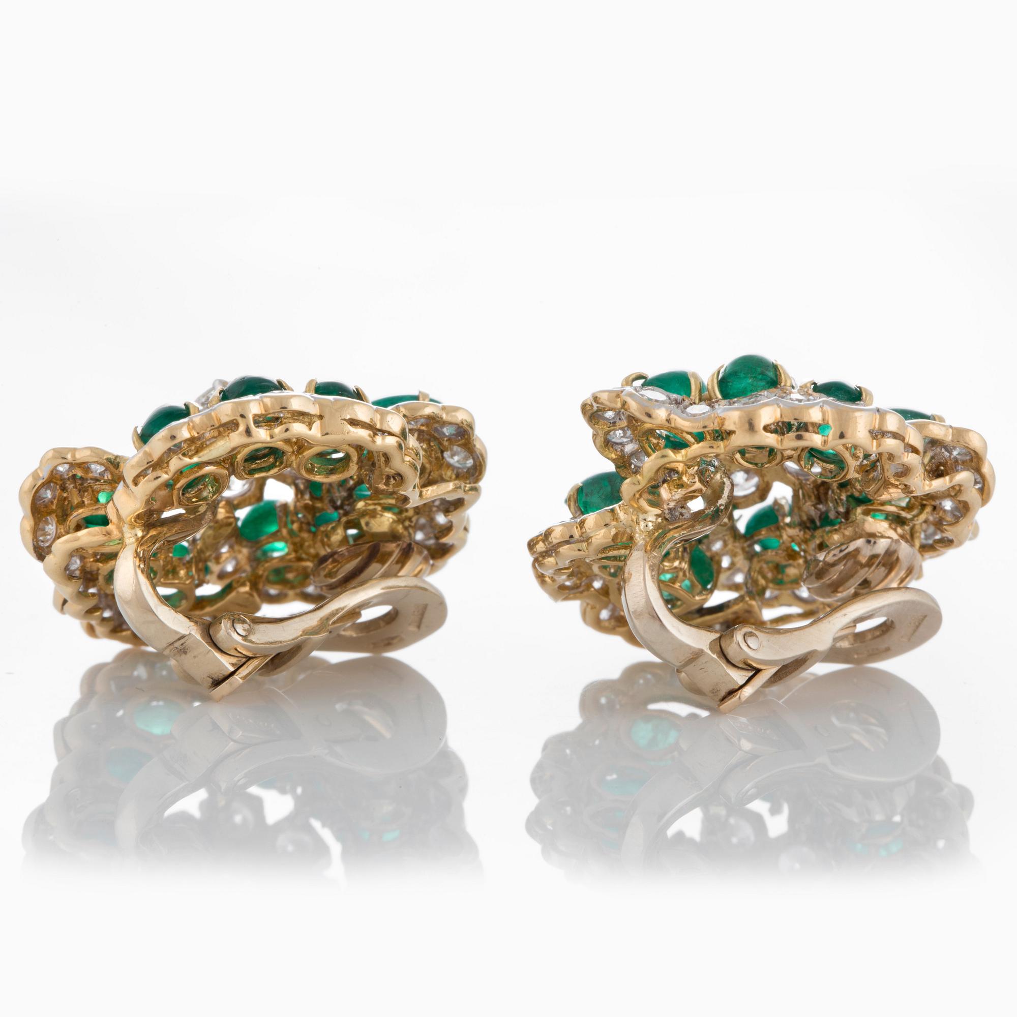 A pair of Bulgari earrings set with cabochon-cut emeralds and round brilliant-cut diamonds.