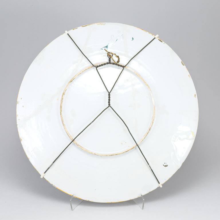 A large majolica 'istoriato' dish and two plates, 20th Century.