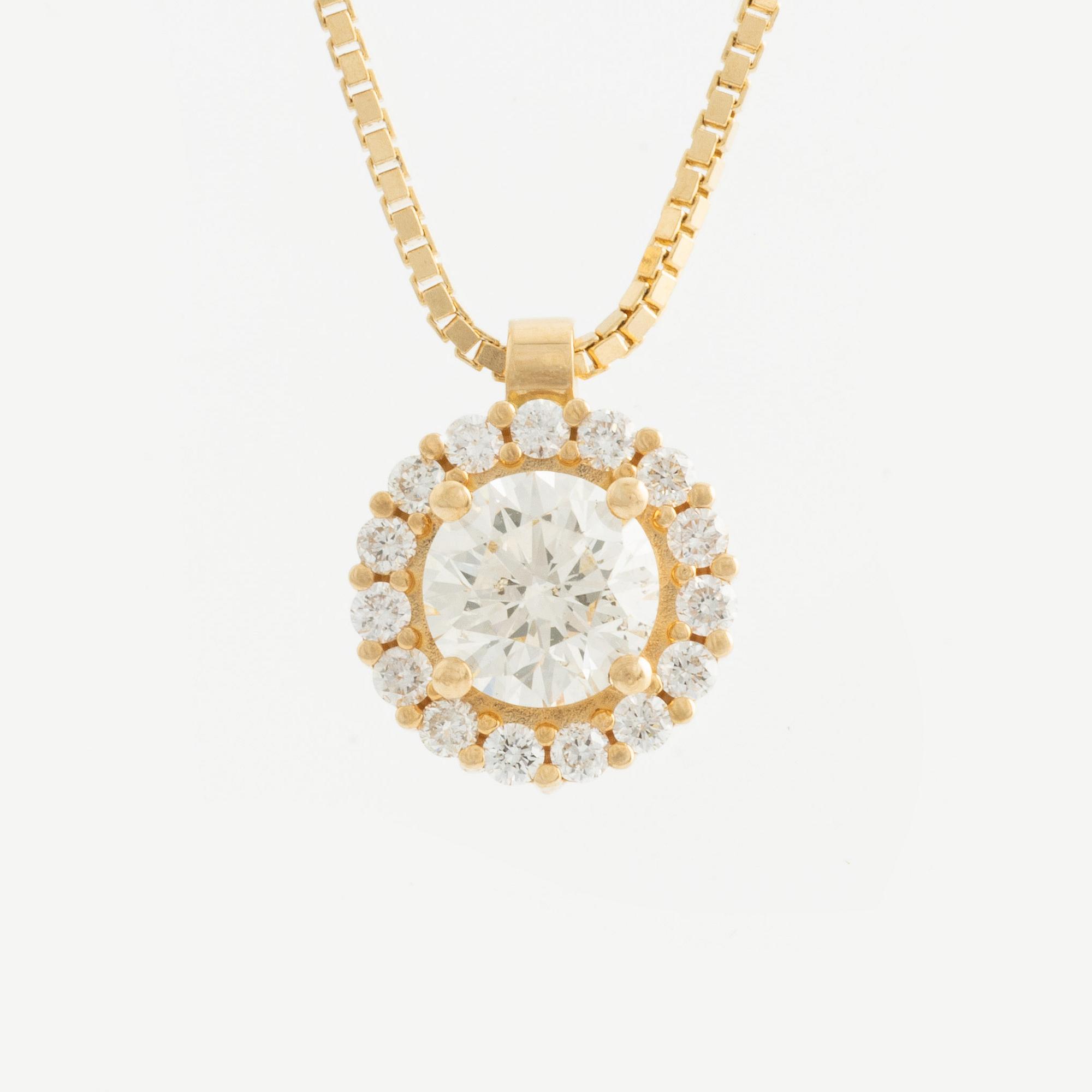 Hängsmycke 18K guld med runda briljantslipade diamanter.