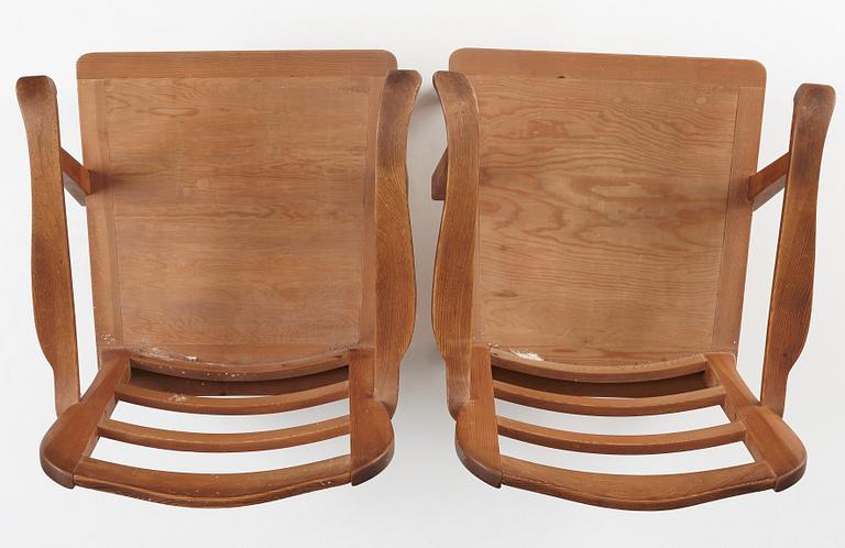 Nordiska Kompaniet, a pair of "sportstugemöbler" stained pine easy chairs, Sweden 1930-40's.