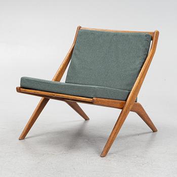 Folke Ohlsson, a pair of oak Frisco easy chairs, Nodafors, 1960s.