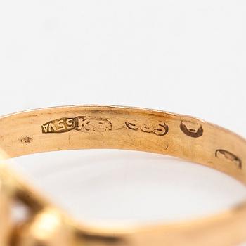 A 14K gold ring.