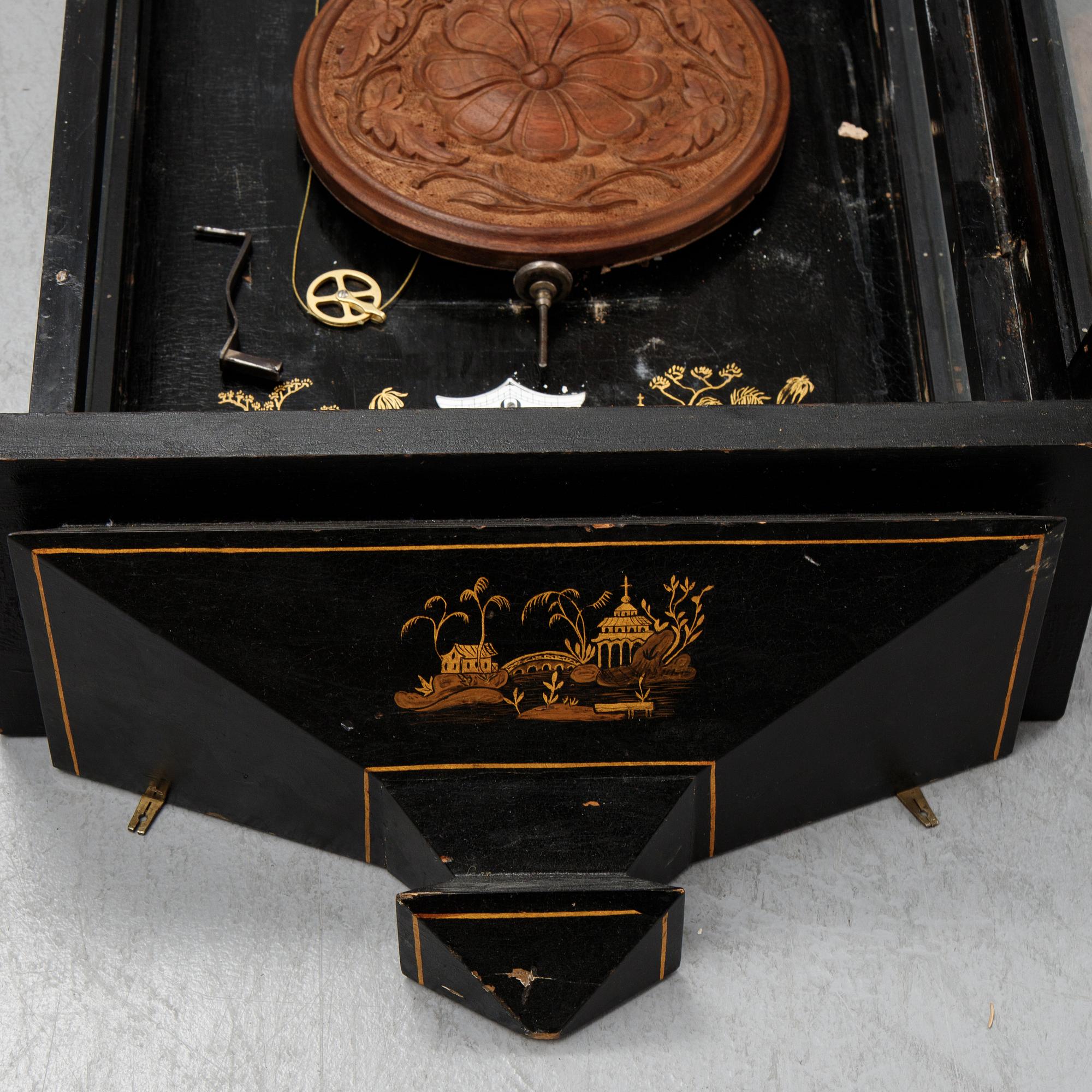 A lacquerwork wall pendulum clock, late 19th Century.