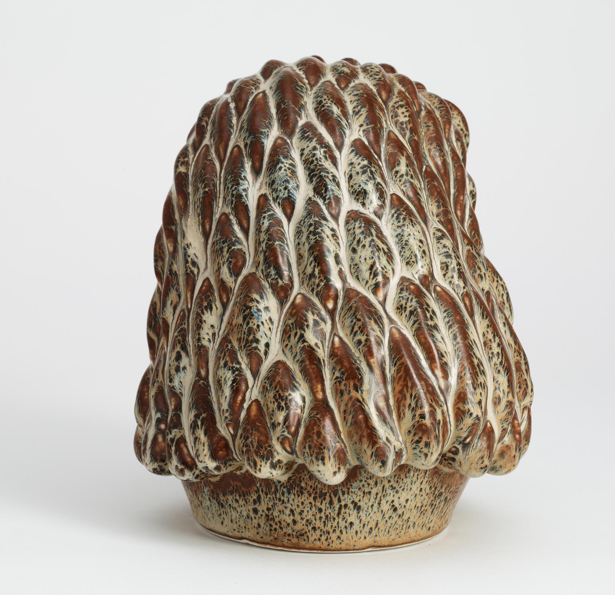 A Gunnar Nylund stoneware figure of a lion's head, Rörstrand.