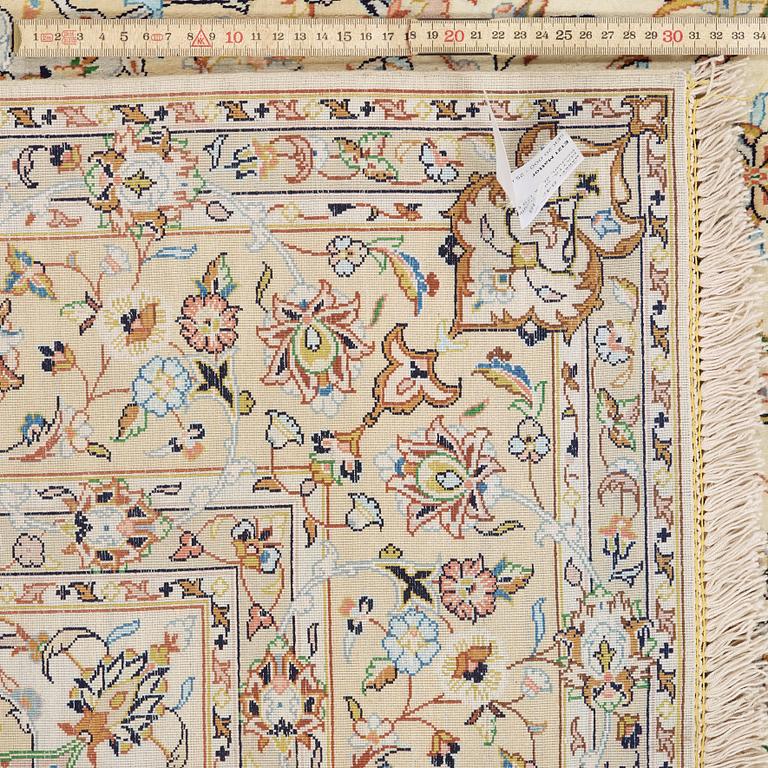 A silk rug from possibly from Kashan, 201 x 139 cm.