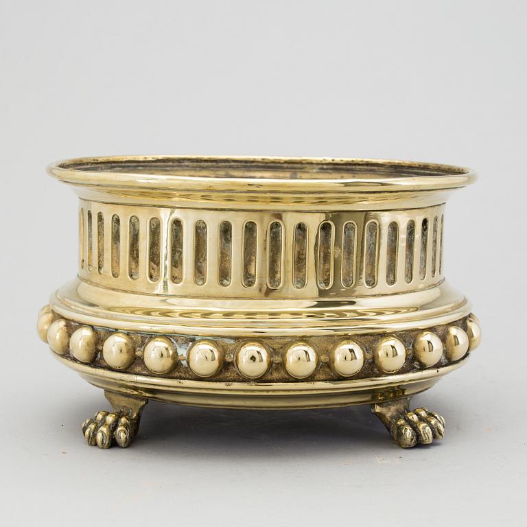 A mid 1800s brass flower pot.