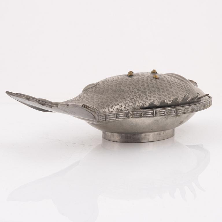 A pewter jelly mould with lid.