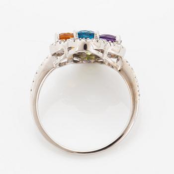 Ring, med fasettslipad topas, ametist, peridot, citrin och briljantslipade diamanter i form av blomma.