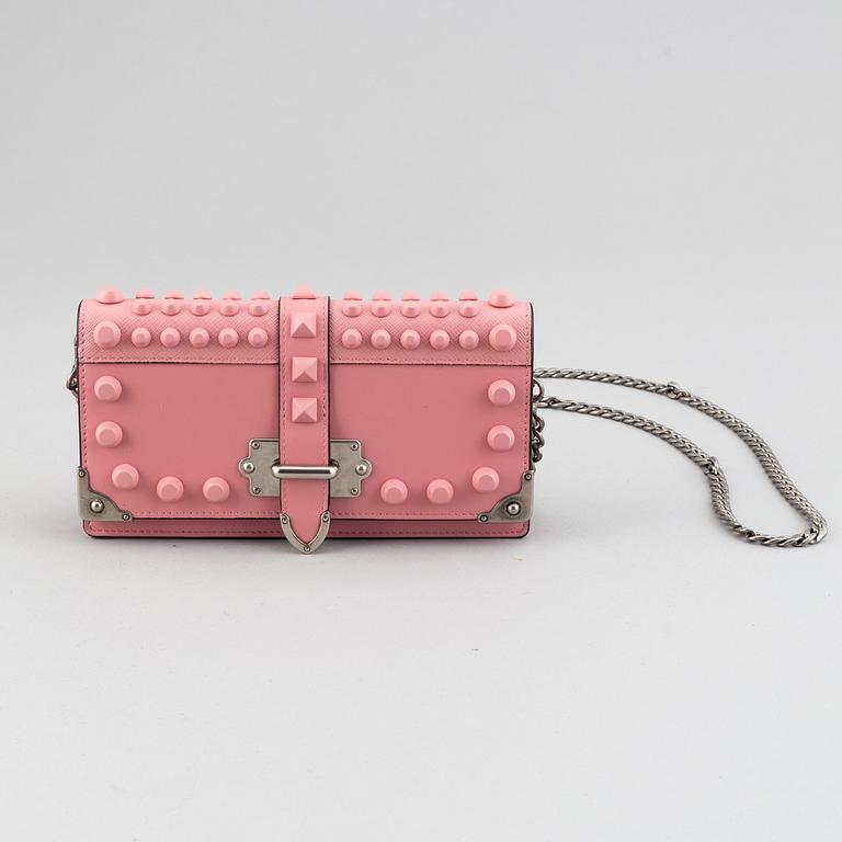 A Prada leather mini bag " Cahier" with metal details and rivets. Marked "Prada Milano". Authenticity card included.