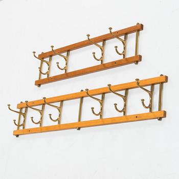 Two mid 20th century brass and teak coat hanger "Dekorativ" from Skoglunds metallgjuteri, Anderstorp.