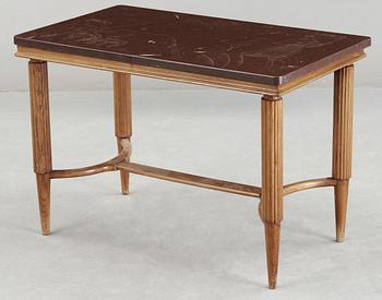 A Swedish Modern oak and limestone table, the top with engraved scenes, signed US, 1940's.