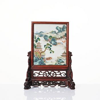 A famille rose table screen in a wooden stand, Qing dynasty, 19th Century.