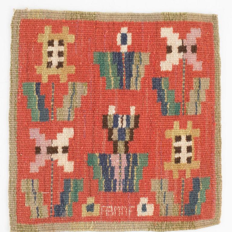 Märta Måås-Fjetterström, a textile,"Blommor på röd botten", flat weave, signed AB MMF,