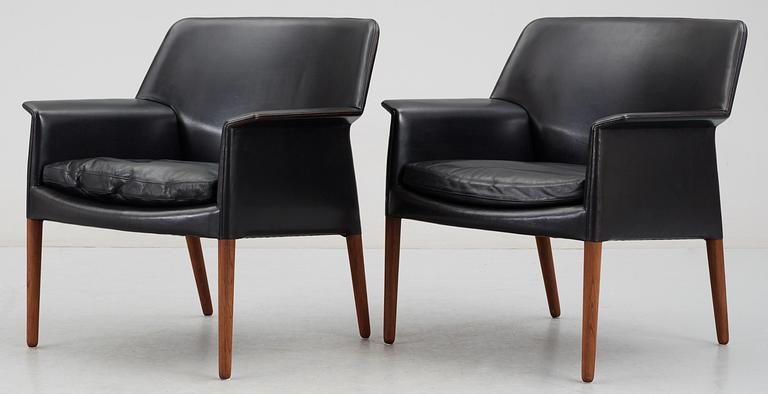 A pair of black leather easy chairs by Ejner Larsen and A Bender Madsen by Willy Beck, Denmark.