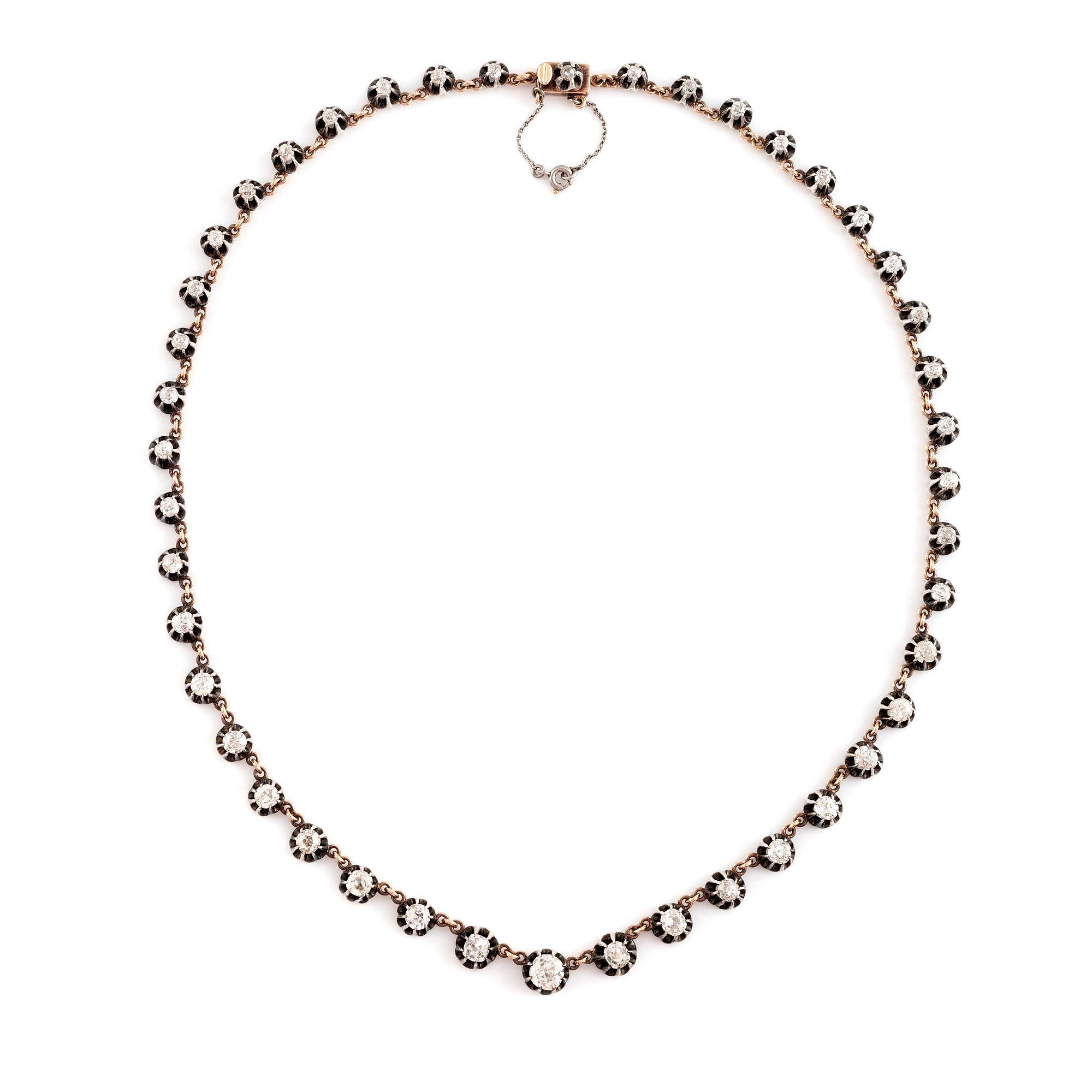 A gold and silver necklace set with old- and rose-cut diamonds.