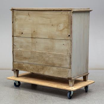 a chest of drawers from the first half of the 19th century.