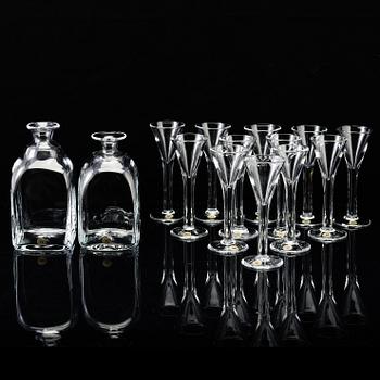 A set of twelve "Antik" shot glasses and two decanters by Reijmyre Glasbruk.