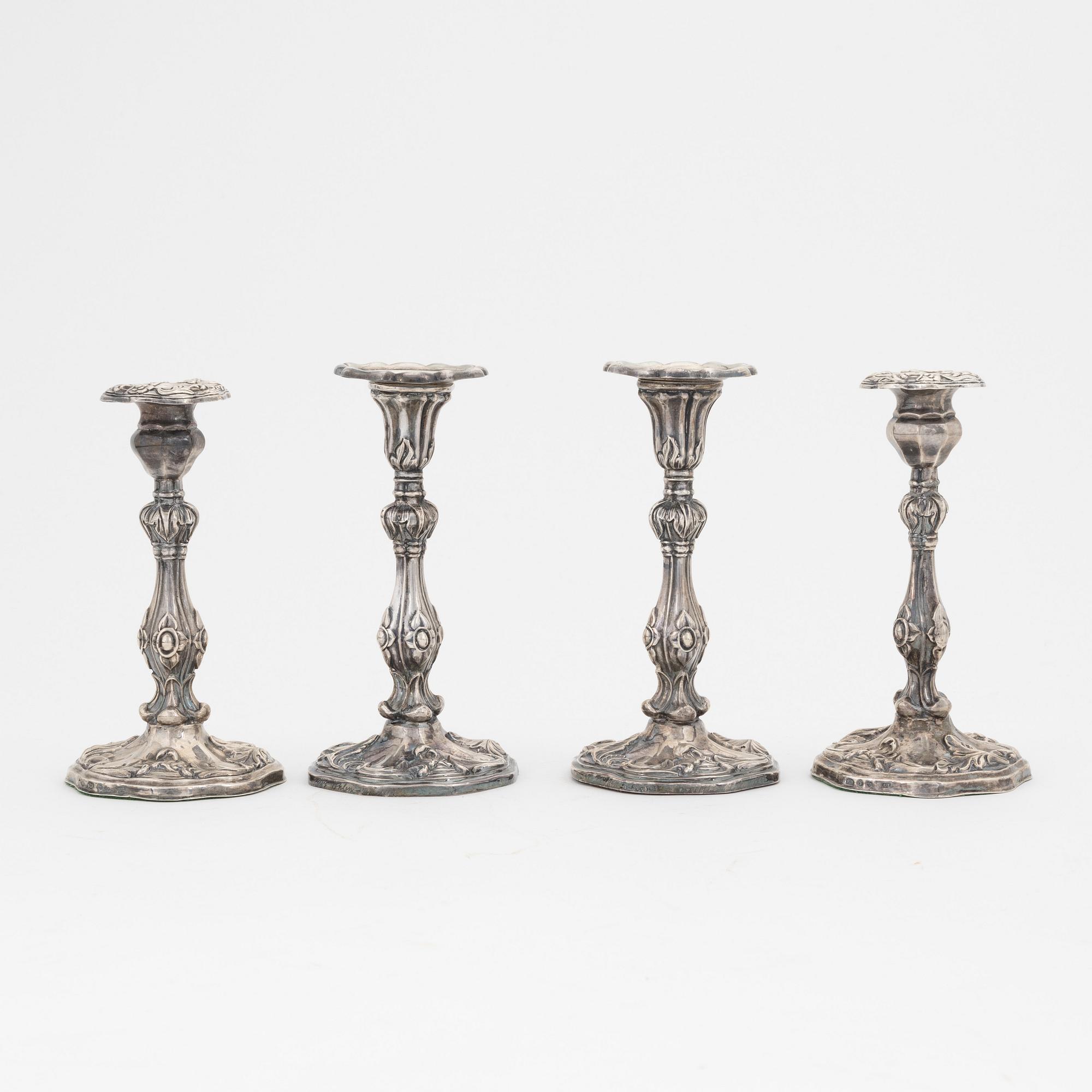 Two pairs of Swedish silver candlesticks, mark of A Lundqvist, Stockholm 1847 and JW Laurén, Stockholm 1854.