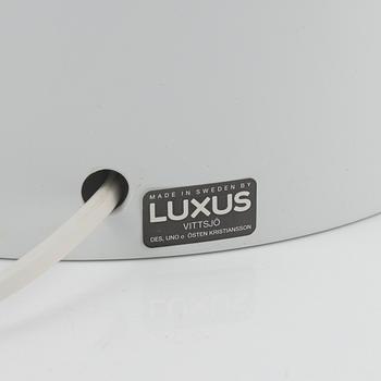 Uno & Östen Kristiansson, a pair of white plastic 'Luno' model 1241 table lights, Luxus, Vittsjö.
