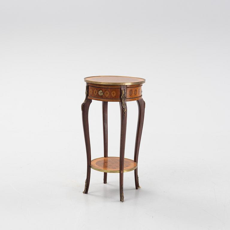 A rococo style table, circa 1900.