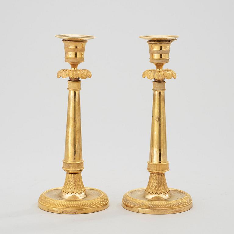 A pair of late Gustavian circa 1800 gilt bronze candlesticks.