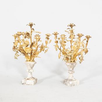 A pair of alabaster and gilded candelabras around 1900.