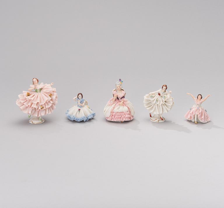 A set of five Dresden porcelain figurines in lace dresses. Mid-20th century.