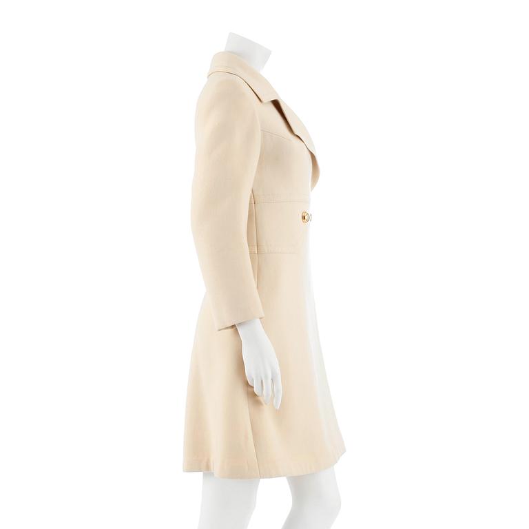 LOUIS FÉRAUD, a light beige wool blend coat, from 1968.