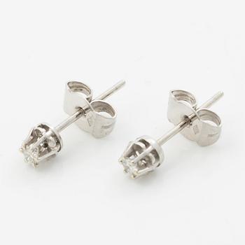 A pair of 18K white gold earrings with round brilliant-cut diamonds.