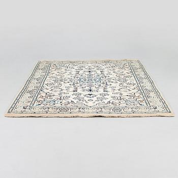 A carpet, Nain Part Silk. Ca 185 x 123 cm.