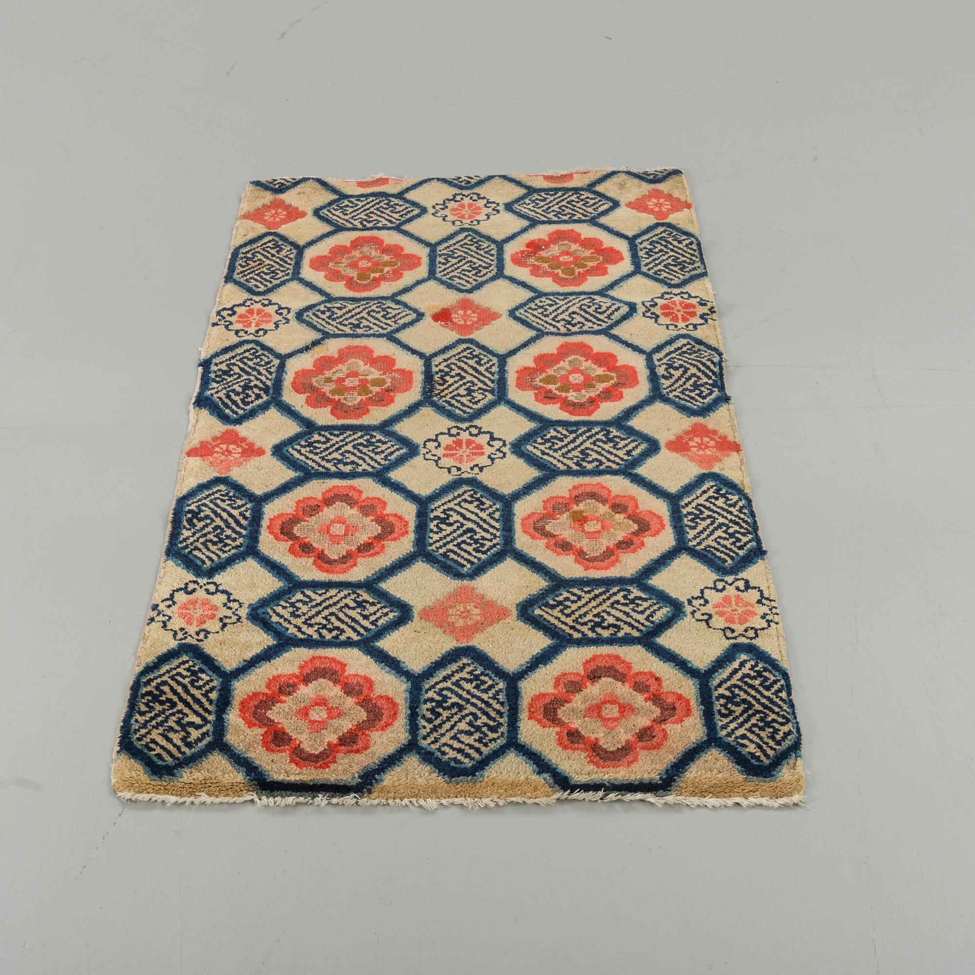A semiantique Tibetan carpet ca 129 x 67 cm.