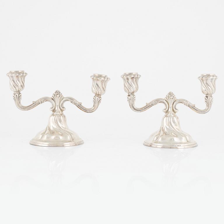A pair of silver candelabras, first half of the 20th Century.