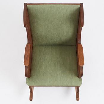 Nordiska Kompaniet, a Swedish Modern stained pine 'Lovö' rocking chair, 1940s.