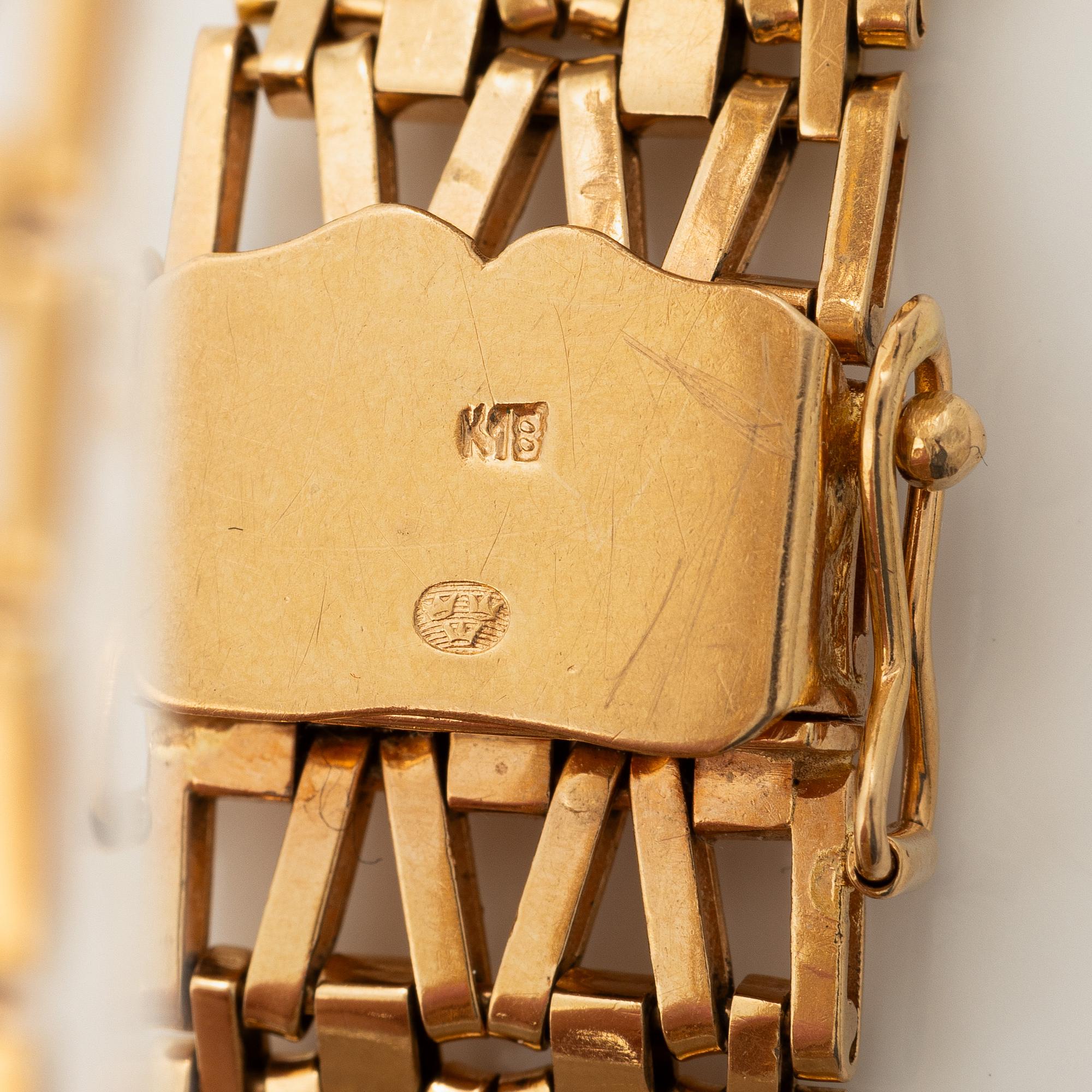 Arm bracelet, 18K gold.