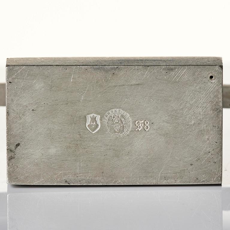 Nils Fougstedt, a pair of pewter candelabra model "A 1047", Firma Svenskt Tenn, Stockholm 1932.
