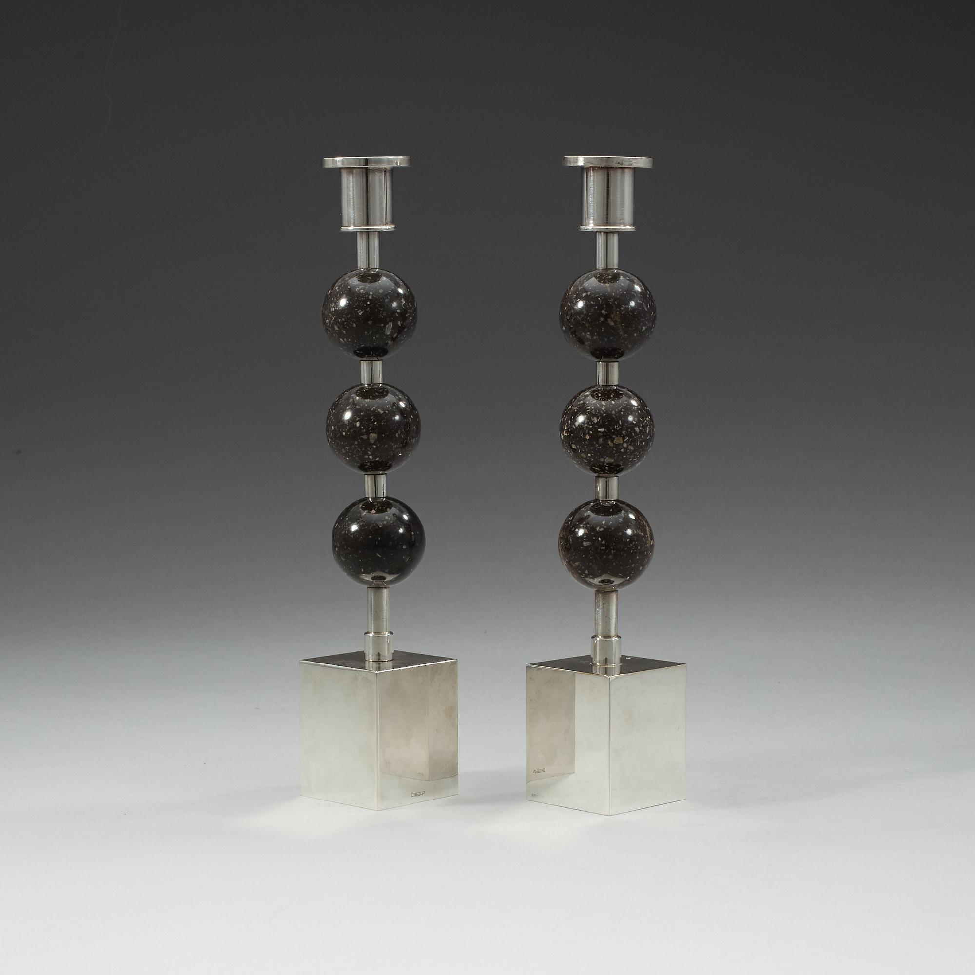 Sigurd Persson, a pair of silver plated and porphyry candlesticks, Sweden.