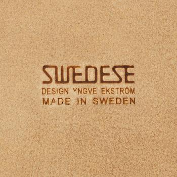 Yngve Ekström, A pair of armchairs, a footstool, “Lamino”, and a side table, Swedese, 2000s.