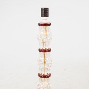 A 1970s glass floor lamp.