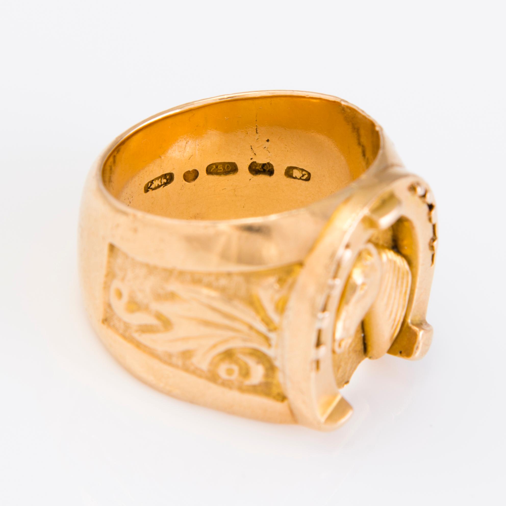 A 18K gold ring with a horseshoe and horse, Finland 1970.