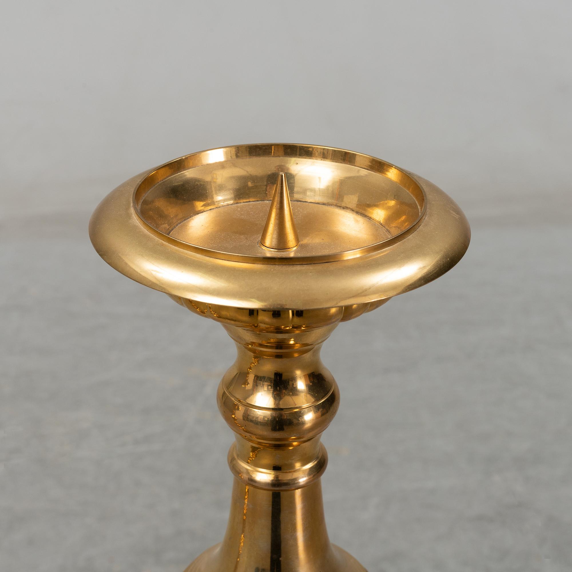 A pair of late 20th century or early 21th century brass altar candlesticks.